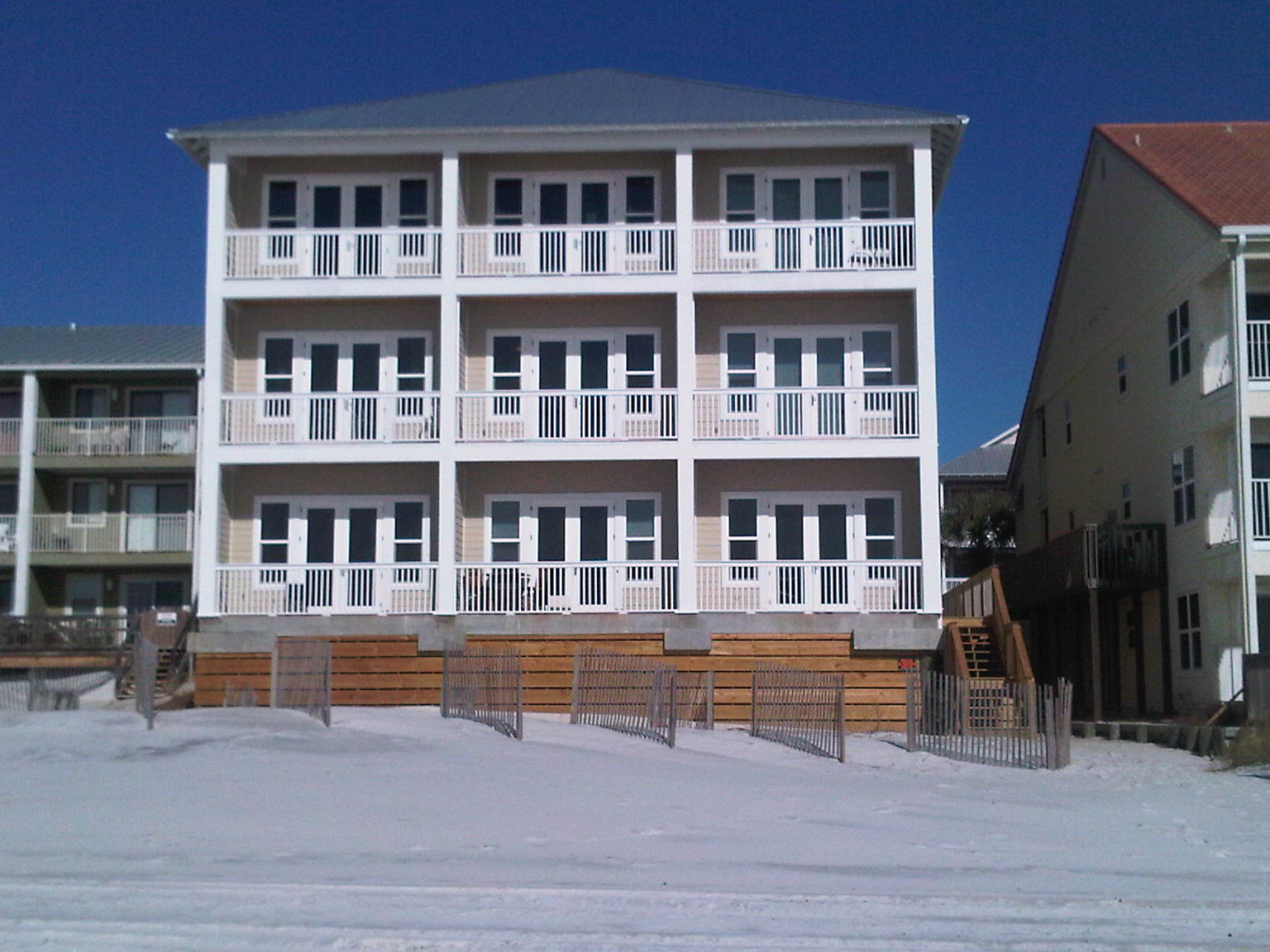 View from the Gulf looking back at Leeward Unit 2 — ground-floor beachfront condo directly on the sand in Seagrove Beach